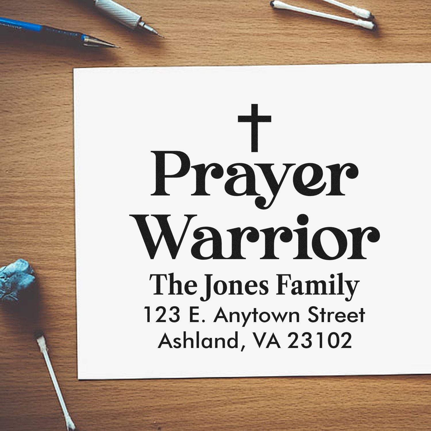 Custom Prayer Warrior rubber stamp with cross, family name, and return address for faith-based mailing and stationery.