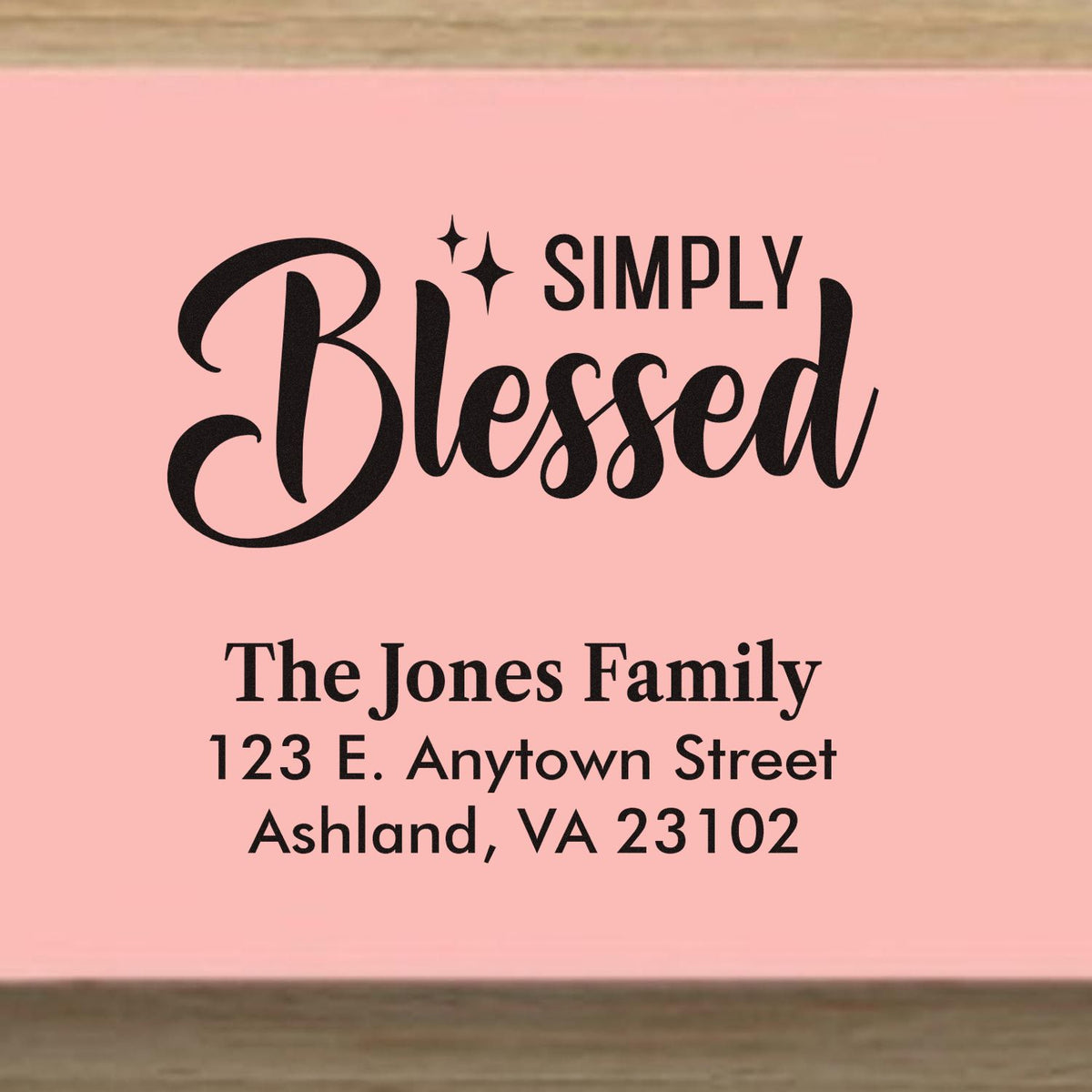 Custom Simply Blessed return address rubber stamp with The Jones Family name and address in elegant script.