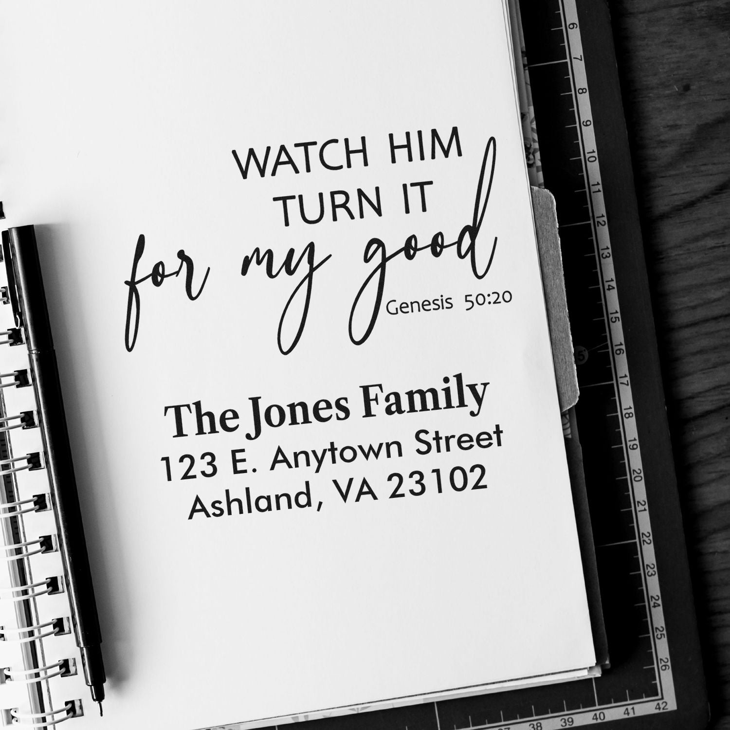 Custom rubber stamp proof with Bible verse, family name, and return address for personalized stationery.