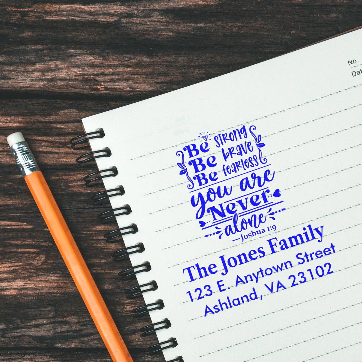 Custom rubber stamps with Bible verse Joshua 1:9 and family address on notebook paper, ideal for personalized stationery and mailings.
