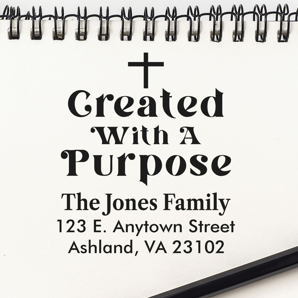 Custom address rubber stamp with cross, family name, and Created With A Purpose Christian design.
