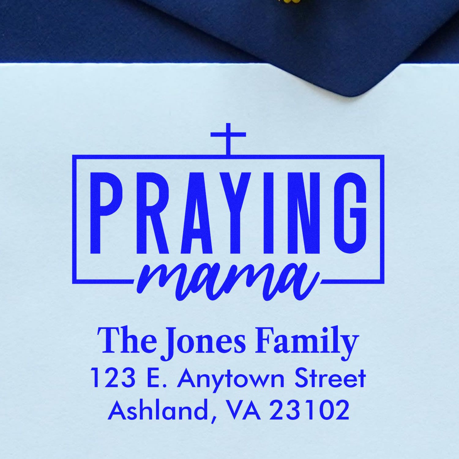 Custom Praying Mama return address rubber stamp with cross, family name, and mailing address for faith-based stationery.