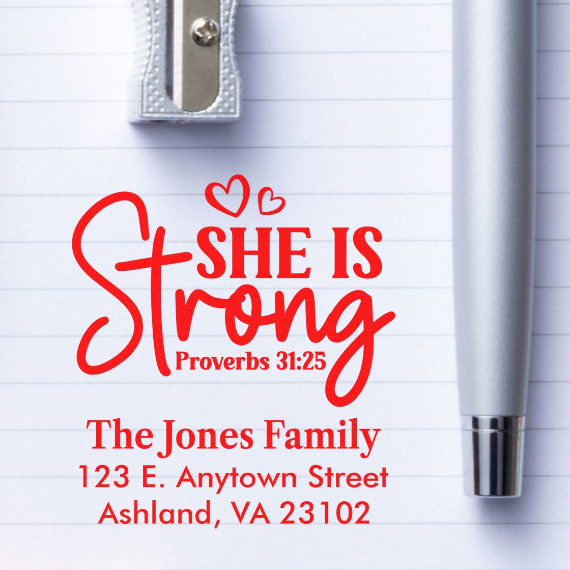 Custom rubber stamp design with "She Is Strong Proverbs 31:25" and The Jones Family return address for personalized mailing.