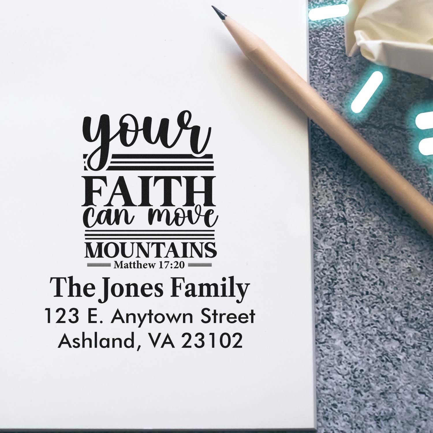 Custom rubber stamp impression with Your faith can move mountains Bible verse and personalized family address.