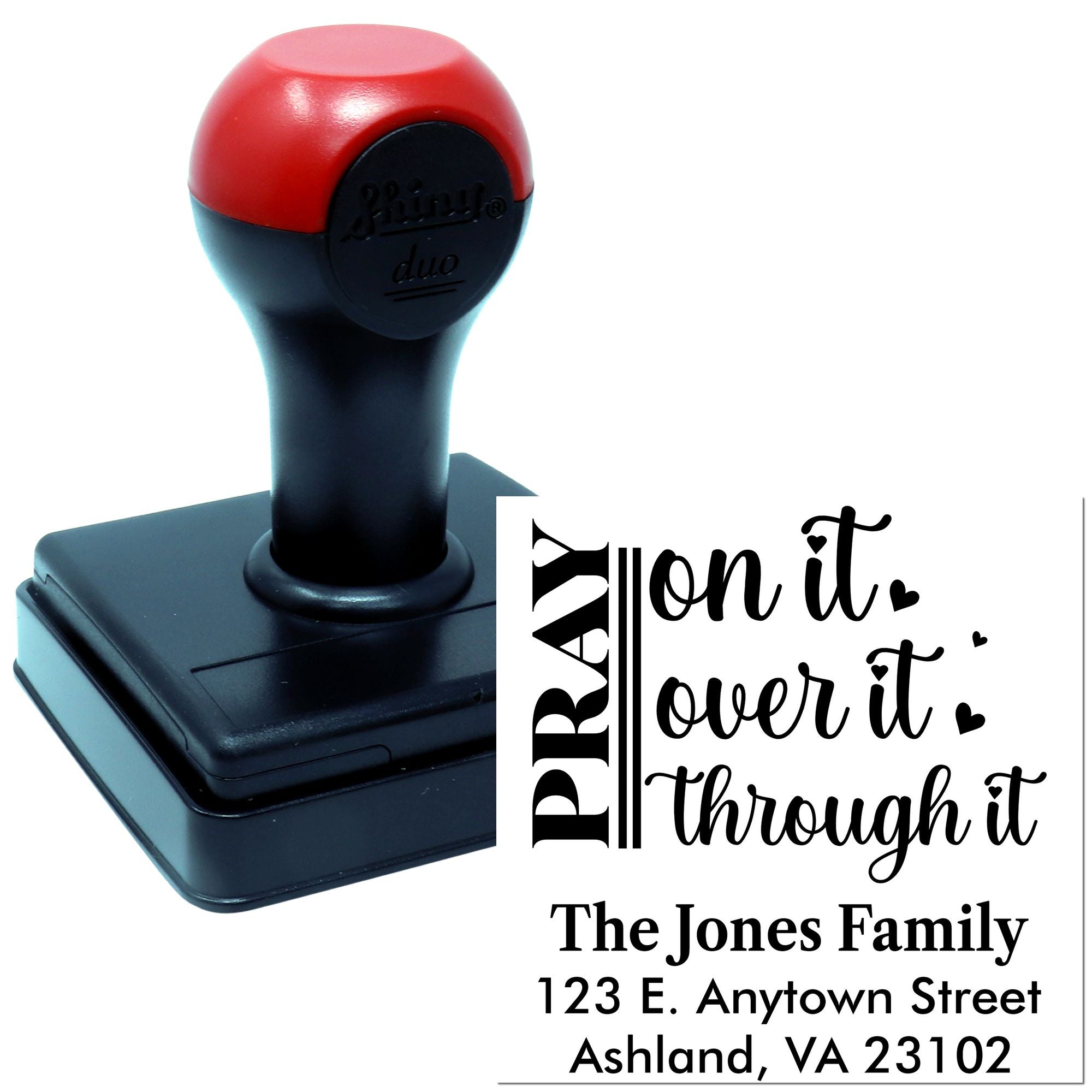 Custom self-inking rubber address stamp with family name, address, and decorative quote design for personalized mailings.