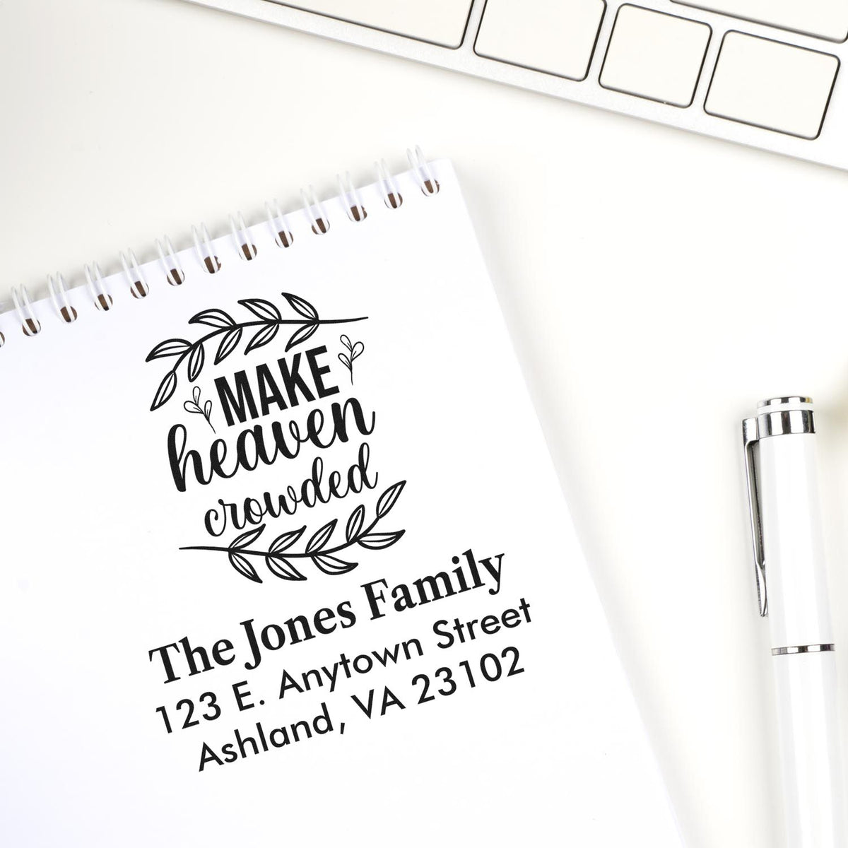 Custom rubber address stamp with Make Heaven Crowded quote, family name, and address for personalized mail and gifts.