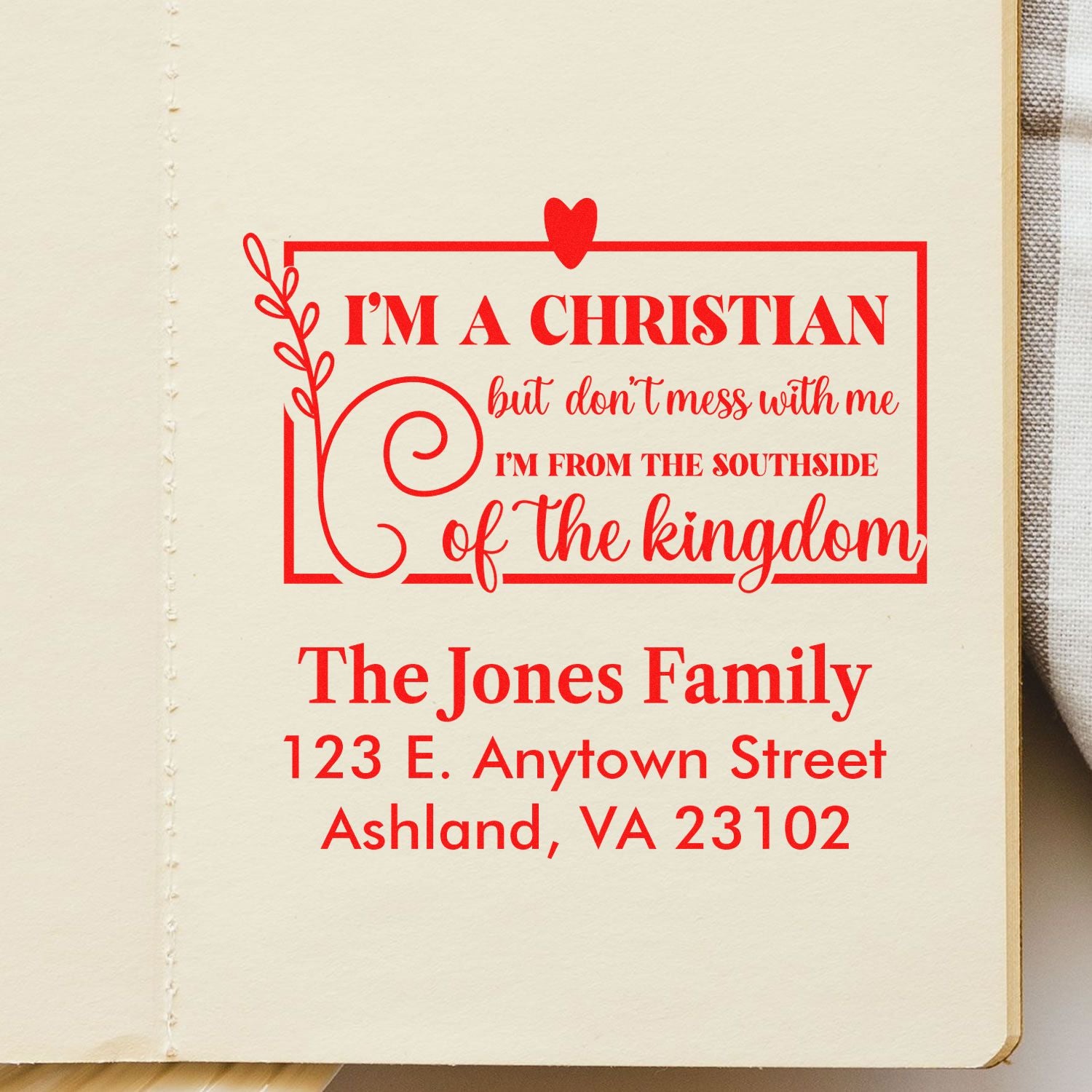 Custom Christian address rubber stamp with family name and bold faith-based quote for personalized mail and stationery.