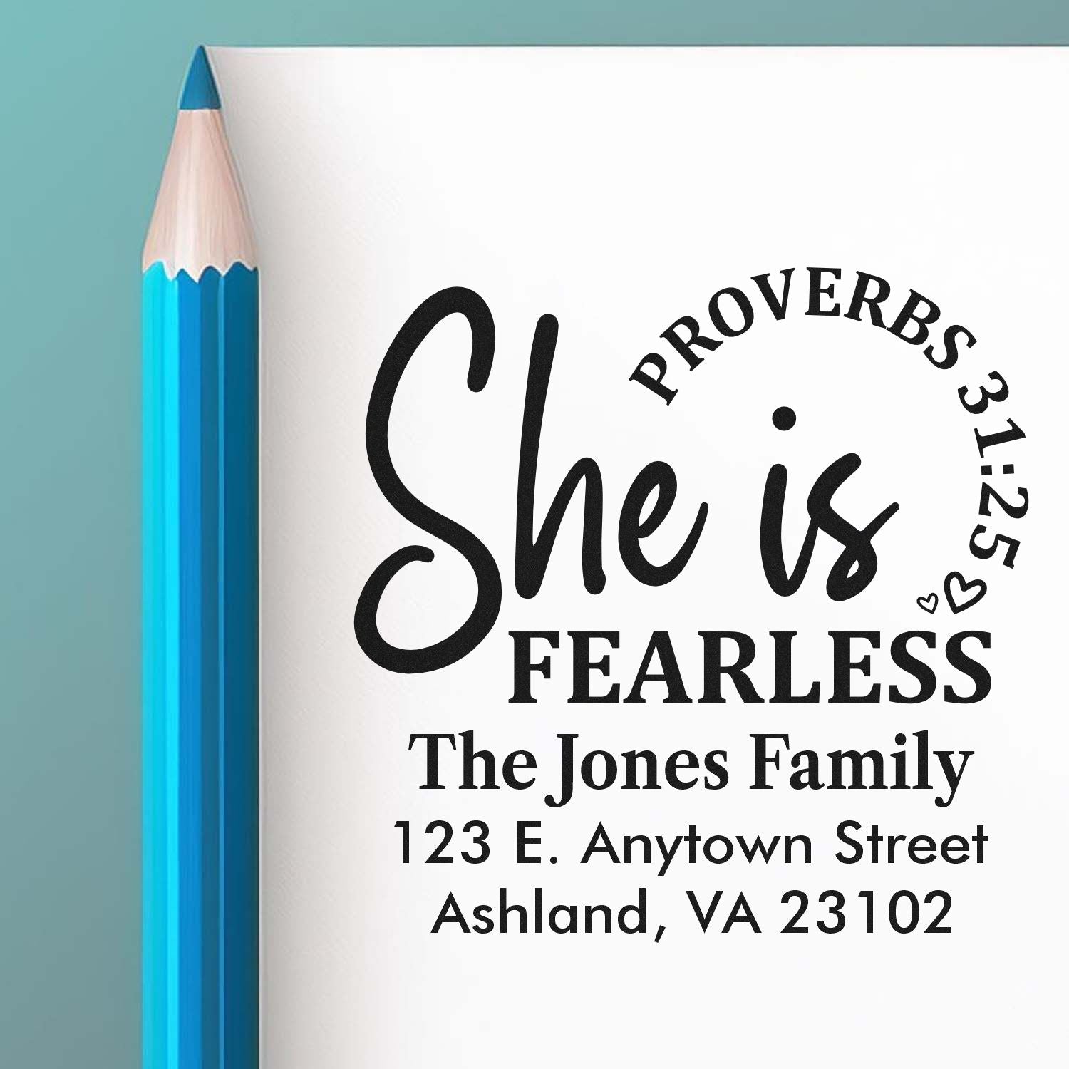 Custom rubber stamp with She is Fearless design, personalized for The Jones Family with name and address.