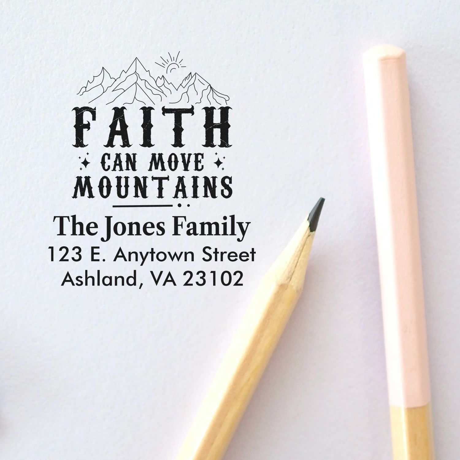 Personalized rubber stamp featuring Faith Can Move Mountains mountain design and family return address for envelopes.