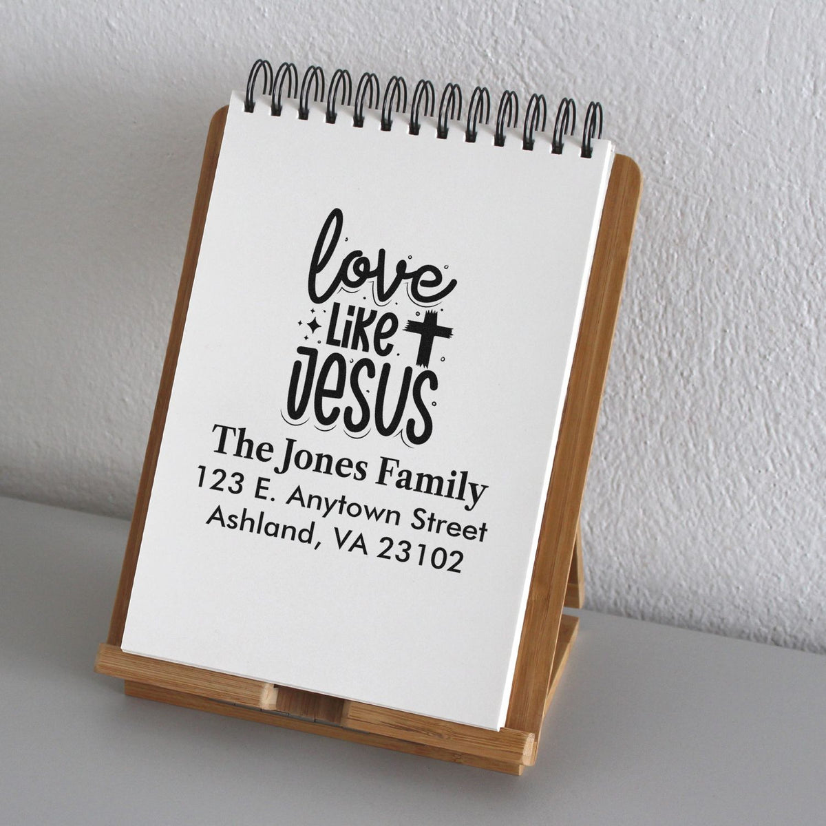 Christian rubber stamp mockup with Love Like Jesus and The Jones Family return address design.