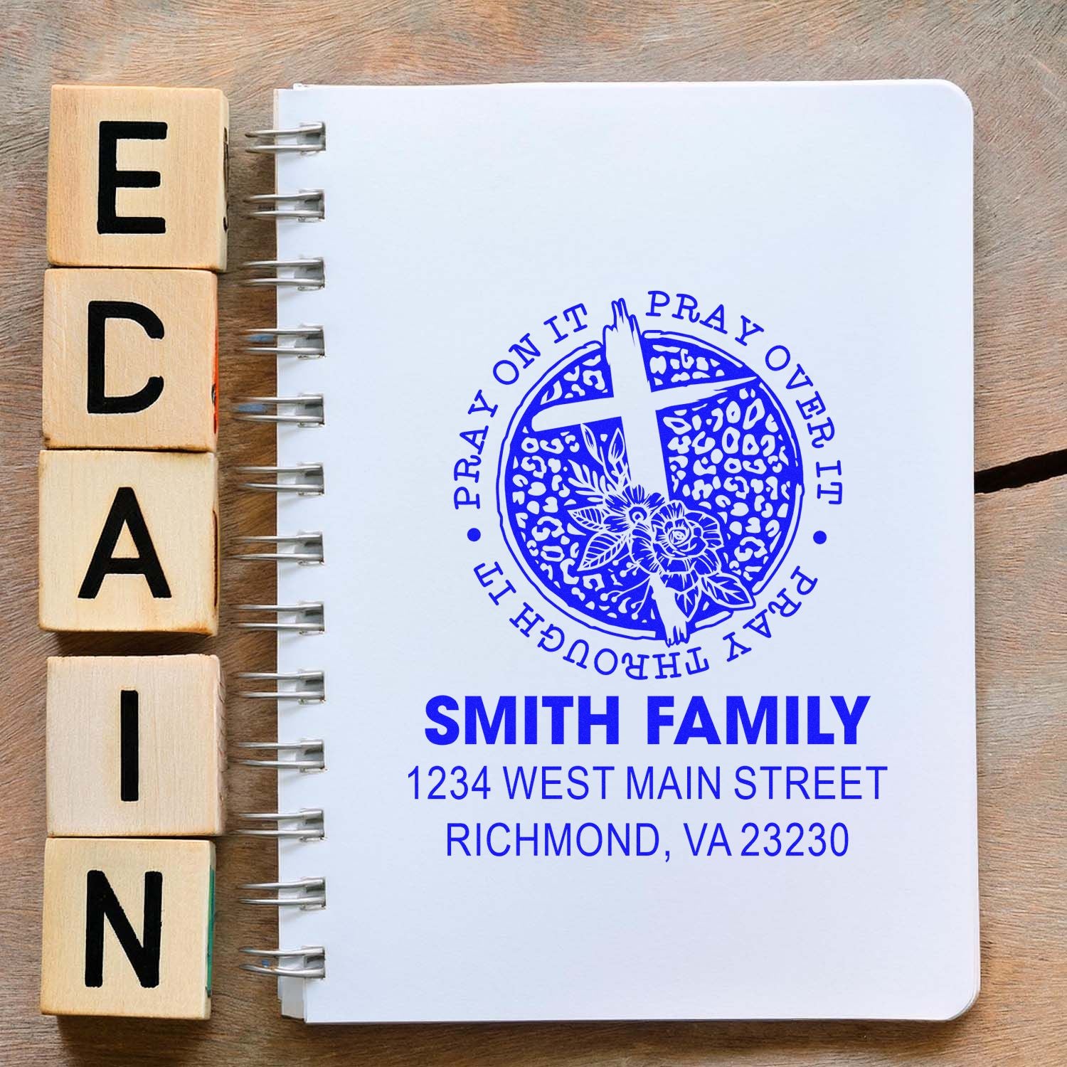 Custom Christian rubber stamp on notebook, featuring Smith Family name, address, and prayer seal for personalized stationery.