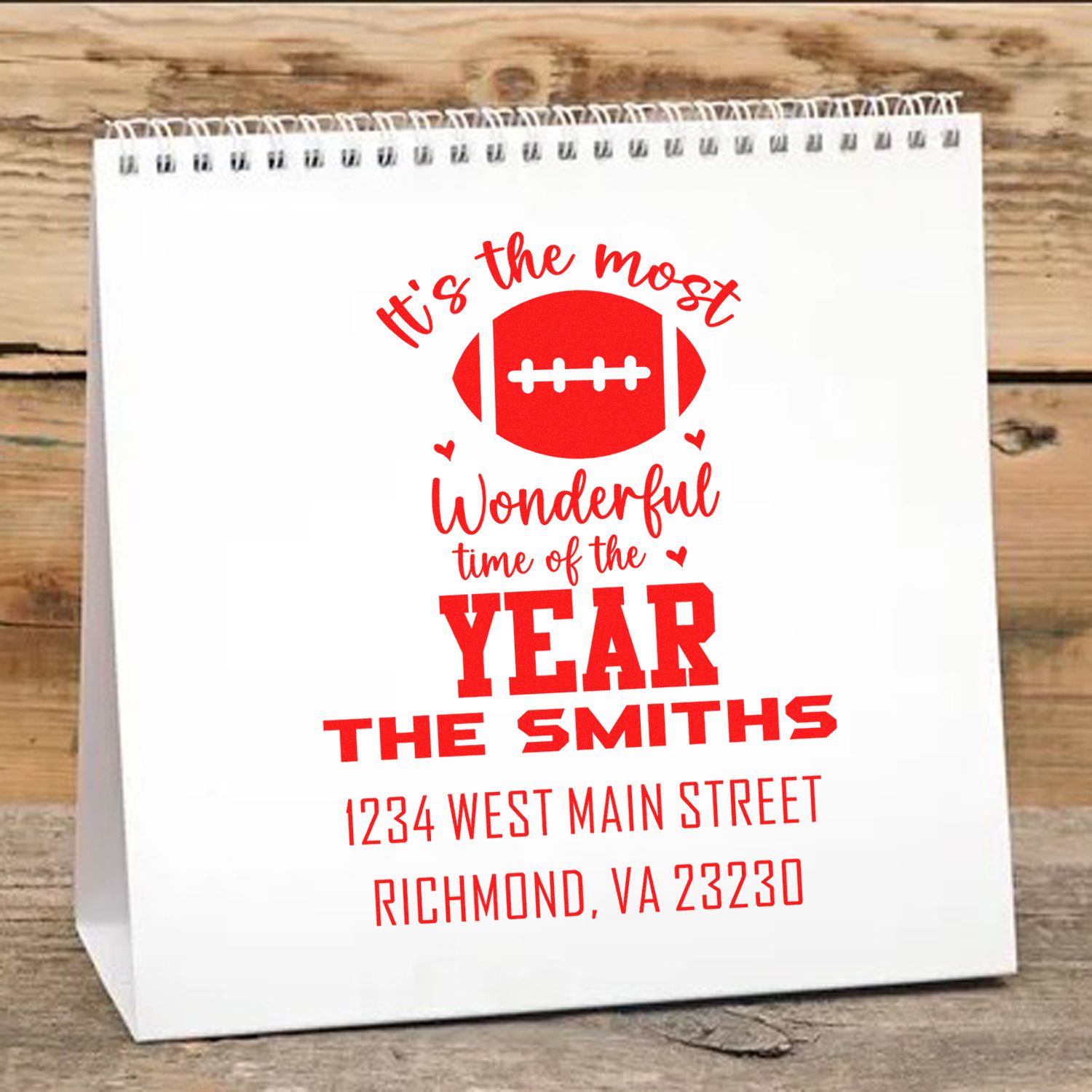 Custom football holiday rubber stamp for Christmas gift bags, featuring family name and address.