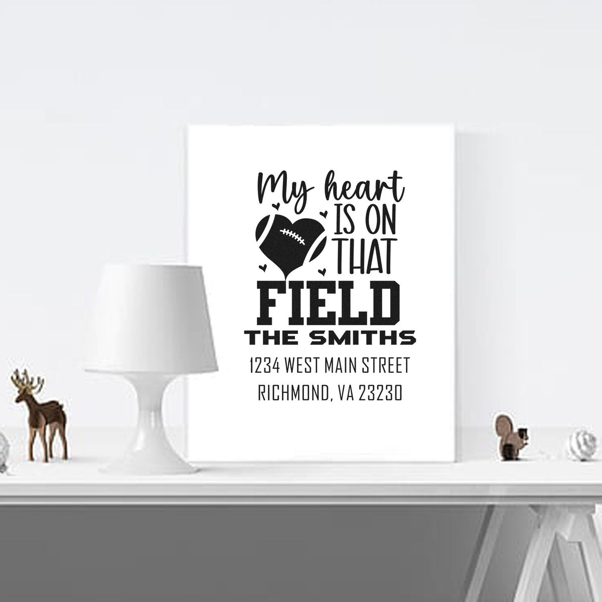 Personalized football heart rubber stamp design with family name and address for custom sports-themed mail or gifts