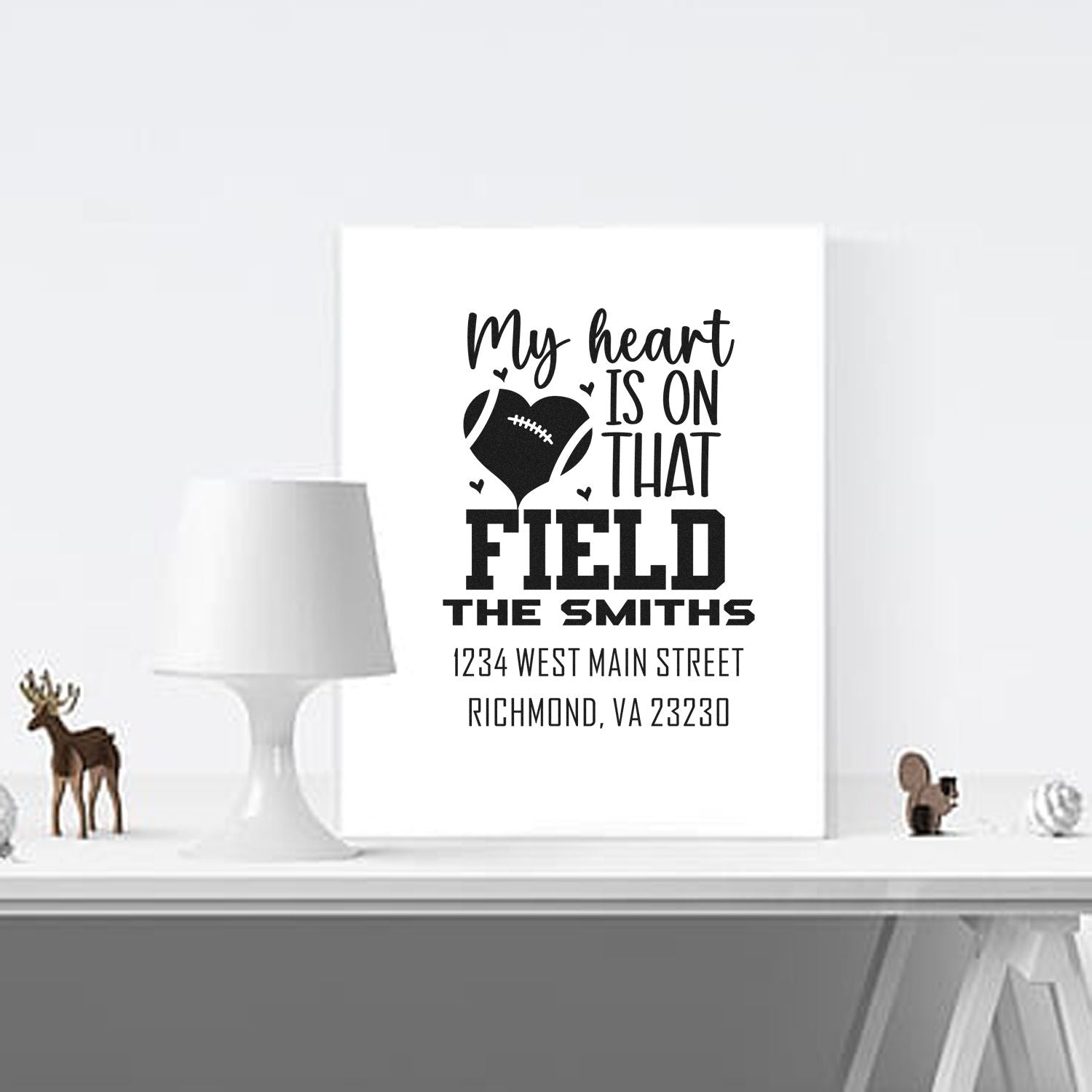 Custom football family rubber stamp design with heart icon, personalized name, and address for sports-loving households.