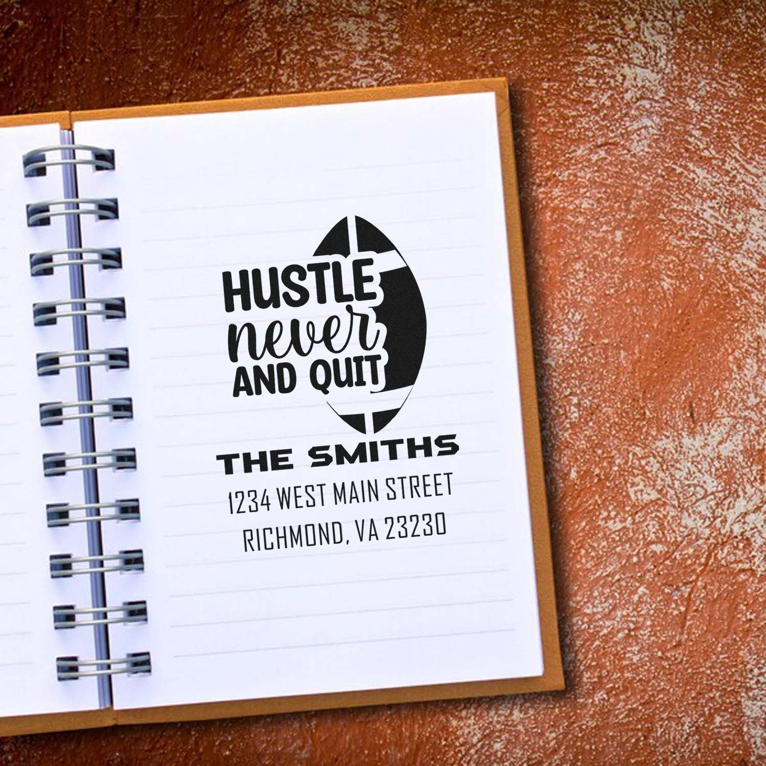 Personalized rubber stamp with Hustle Never Quit logo and return address for The Smiths business on a notebook page.