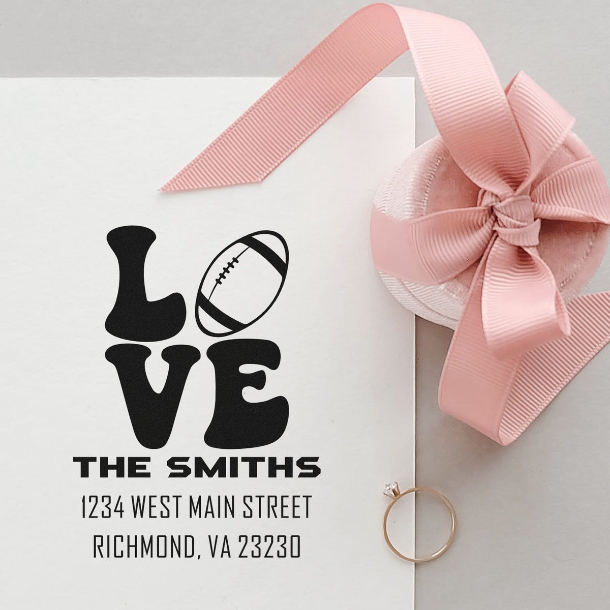 Custom football-themed return address rubber stamp for The Smiths on a wrapped gift package.