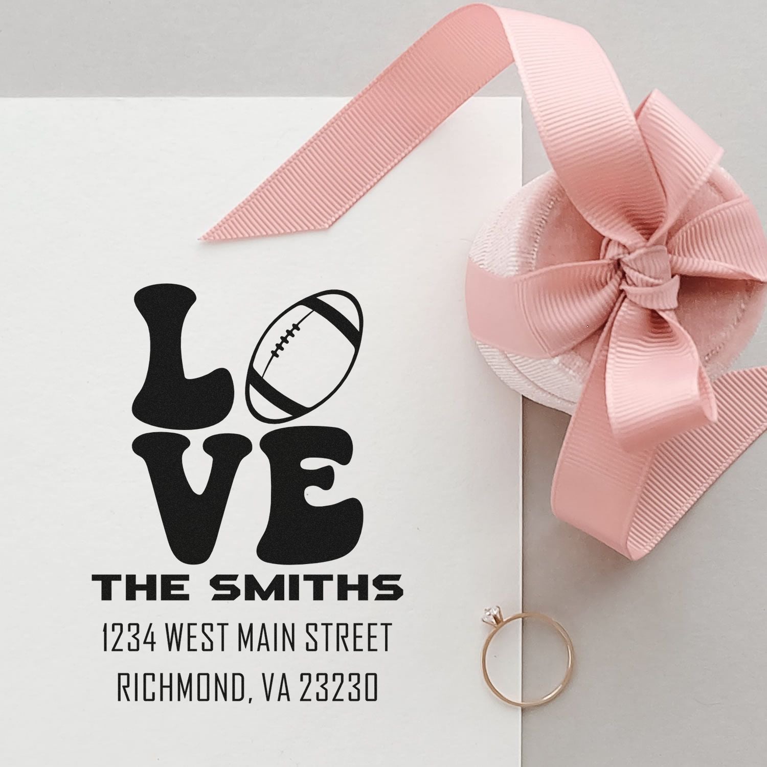 Custom rubber stamp with LOVE football design, The Smiths address, for wedding invitations and personalized stationery.