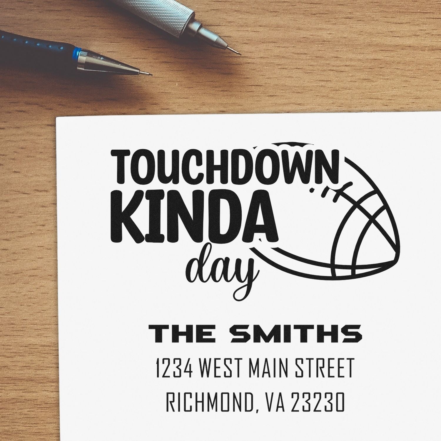 Custom football rubber stamp with Touchdown Kinda Day, family name, and return address for personalized mail.
