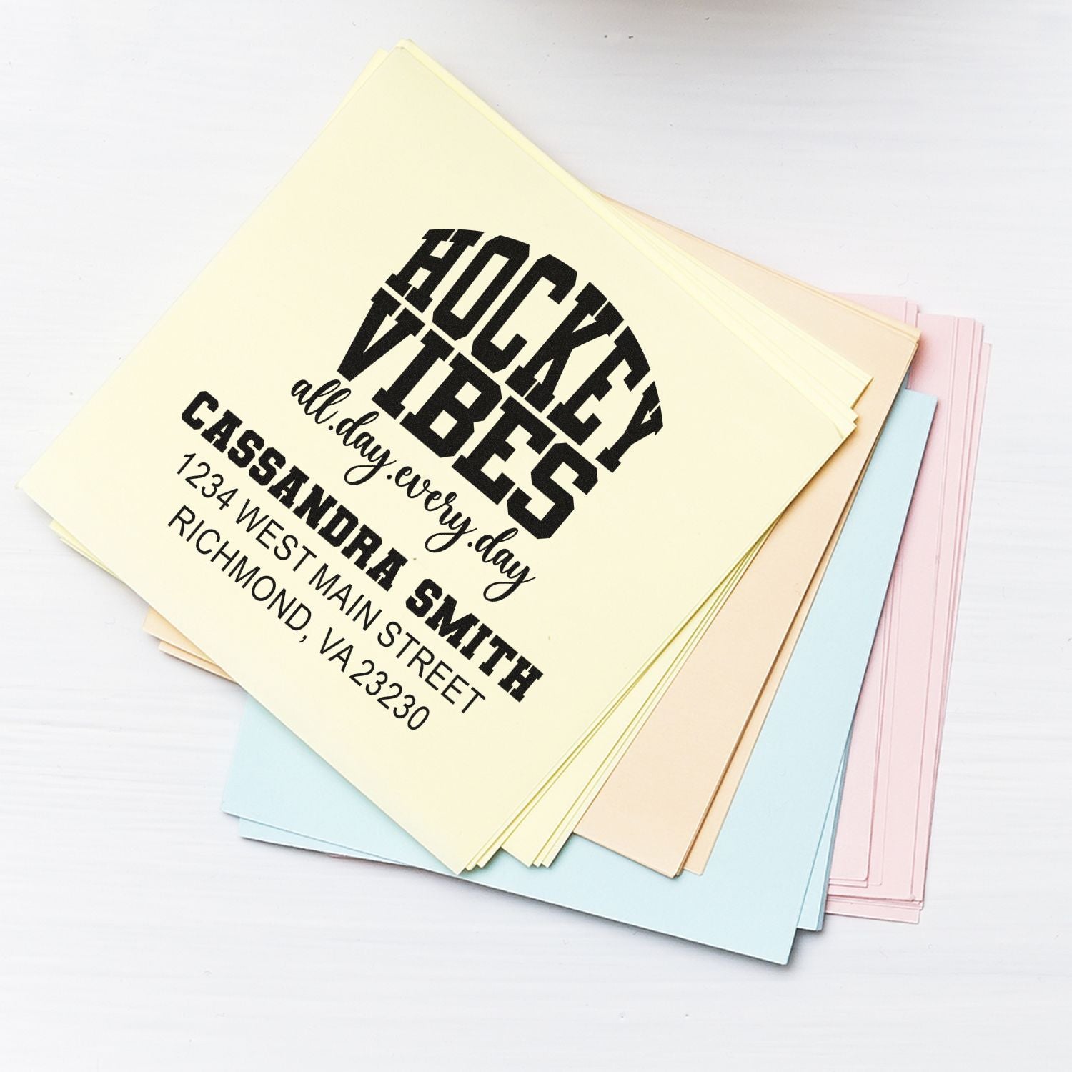 Custom hockey vibes return address rubber stamp on pastel stationery envelopes for sports-themed mailings.
