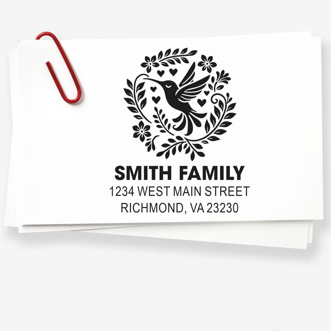 Custom family address rubber stamp with hummingbird floral wreath and name, ideal for envelopes, stationery, and wedding mailings.