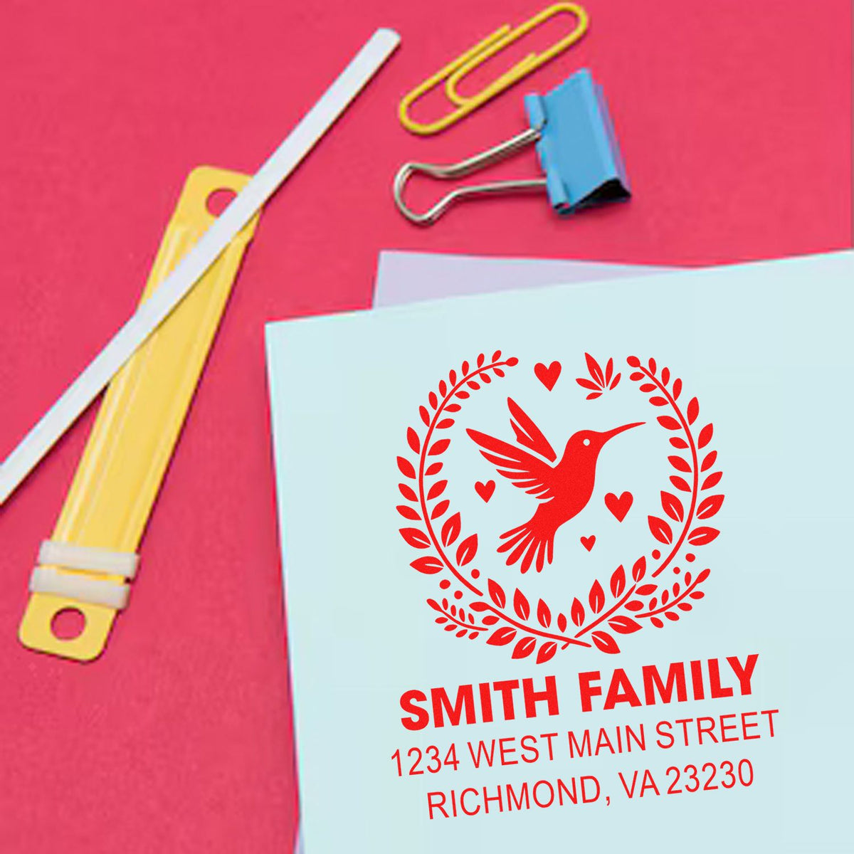 Custom return address rubber stamp with hummingbird wreath design for personalized family mailings.
