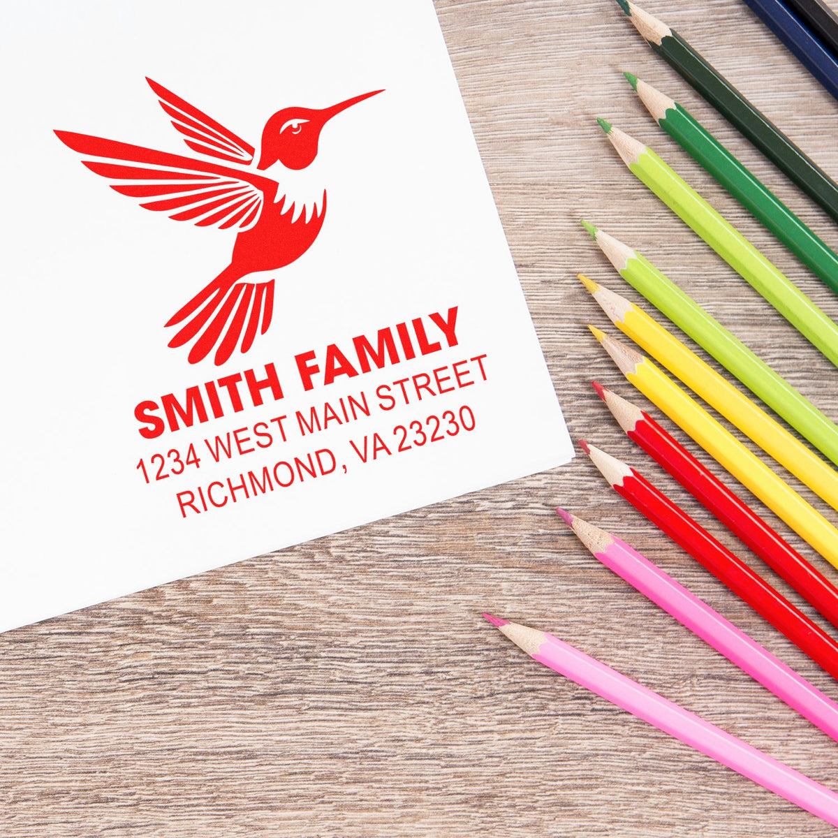 Personalized rubber address stamp with hummingbird logo and Smith Family return address for envelopes and stationery.