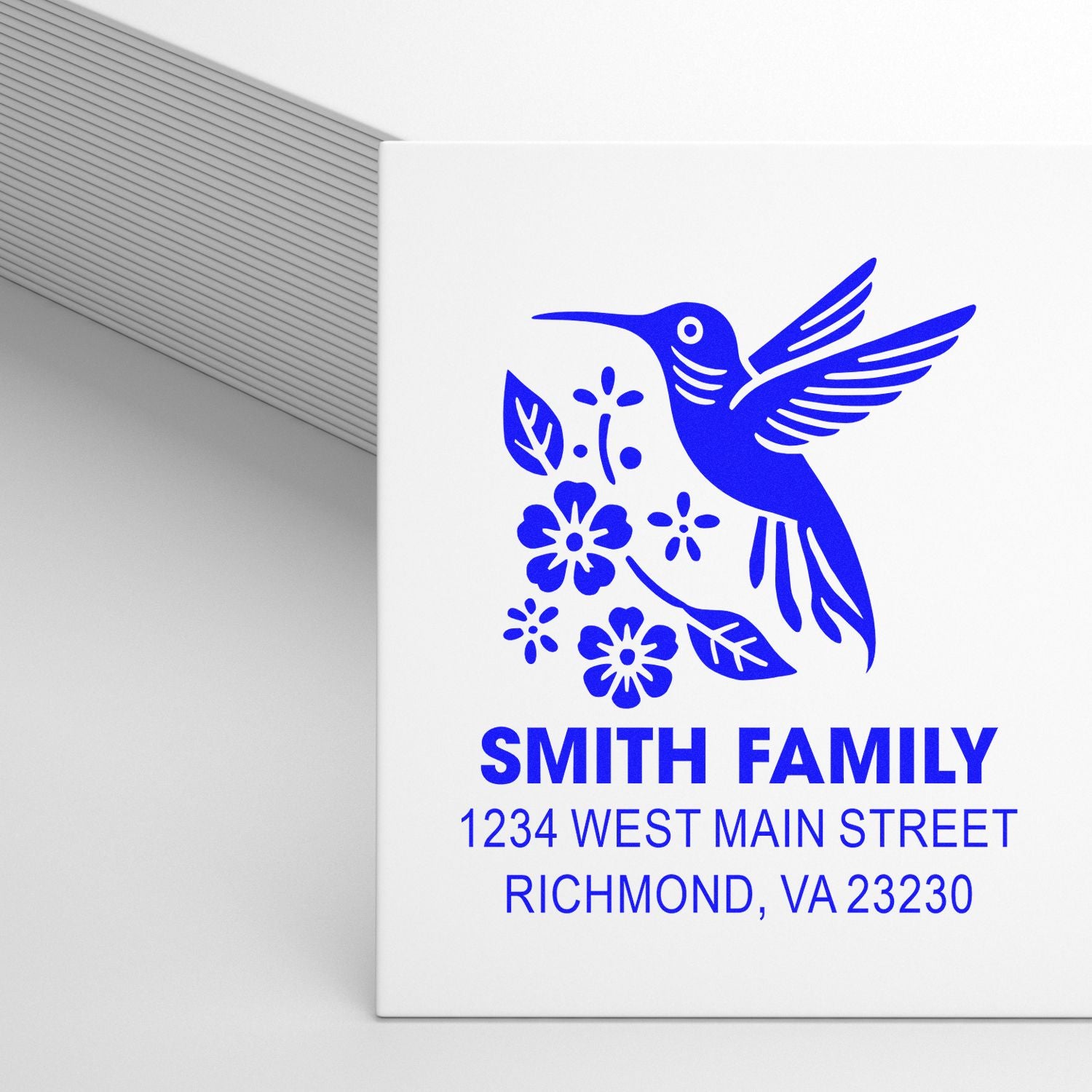 Custom rubber address stamp with hummingbird floral design for Smith Family, Richmond, VA return mailing.