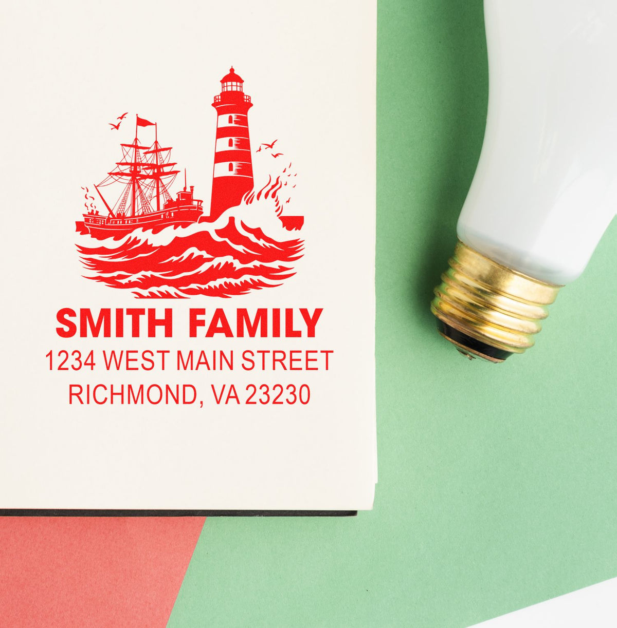 Custom family address rubber stamp with lighthouse and ship design for personalized mail, cards, and stationery.