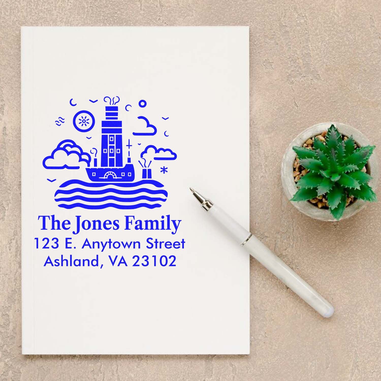Personalized return address rubber stamp with lighthouse design, family name, and address for custom envelopes.