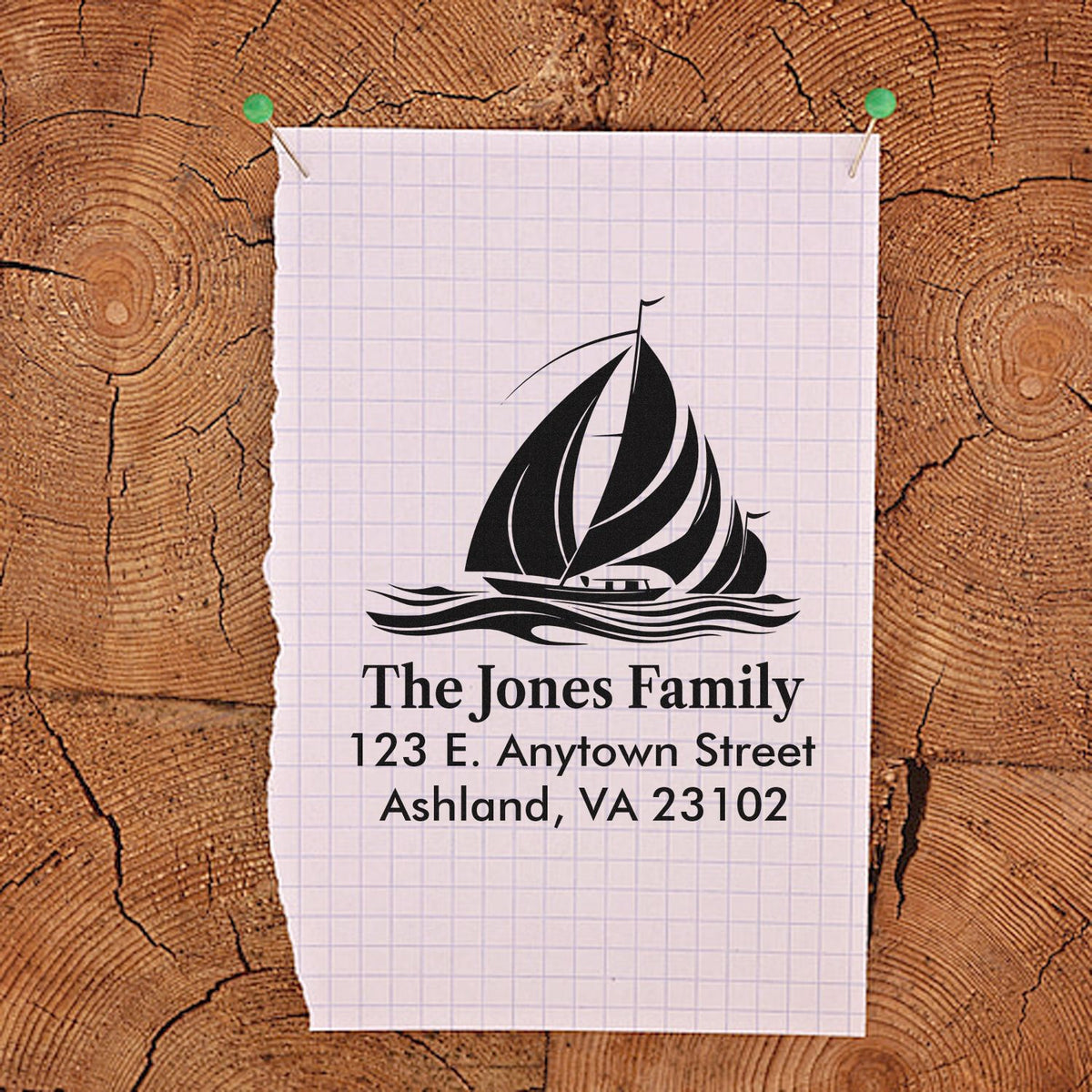 Custom rubber address stamp with sailboat logo and The Jones Family return address.