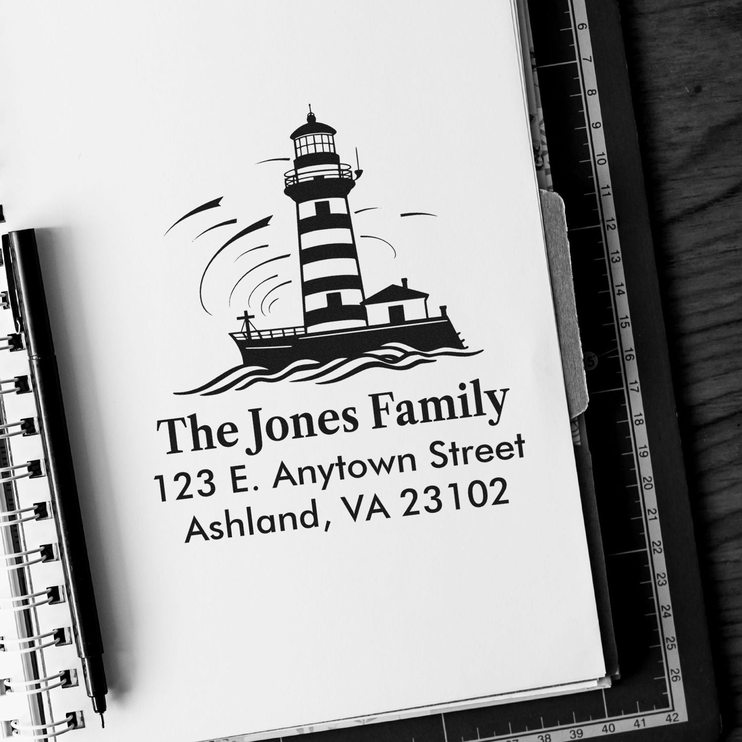 Custom lighthouse return address rubber stamp with family name and address for personalized stationery and mail.