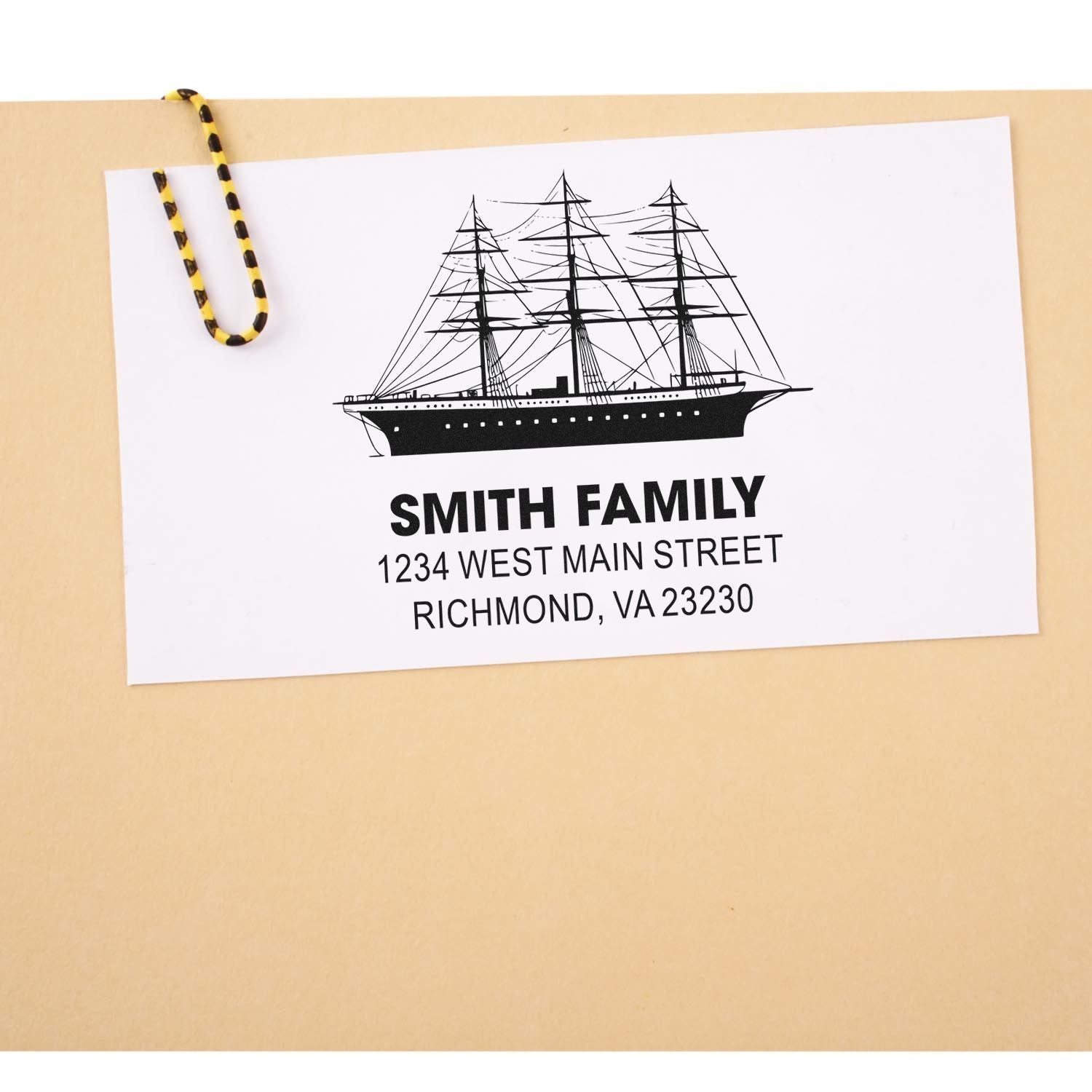 Personalized rubber stamp with ship logo, Smith Family name, and address for custom mailing and stationery.