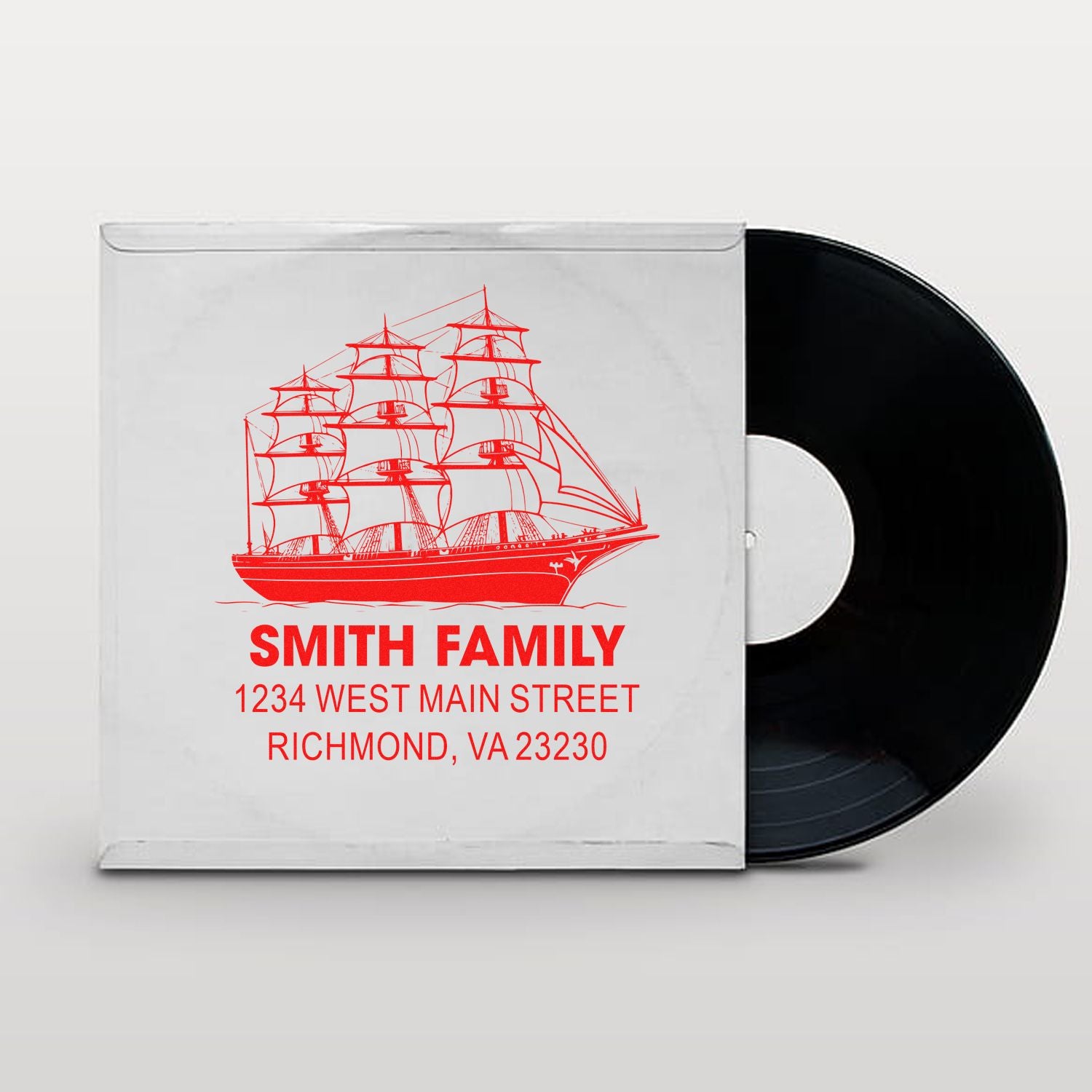 Custom rubber stamp with sailing ship design, Smith Family name, and return address for personalized mailing and branding.