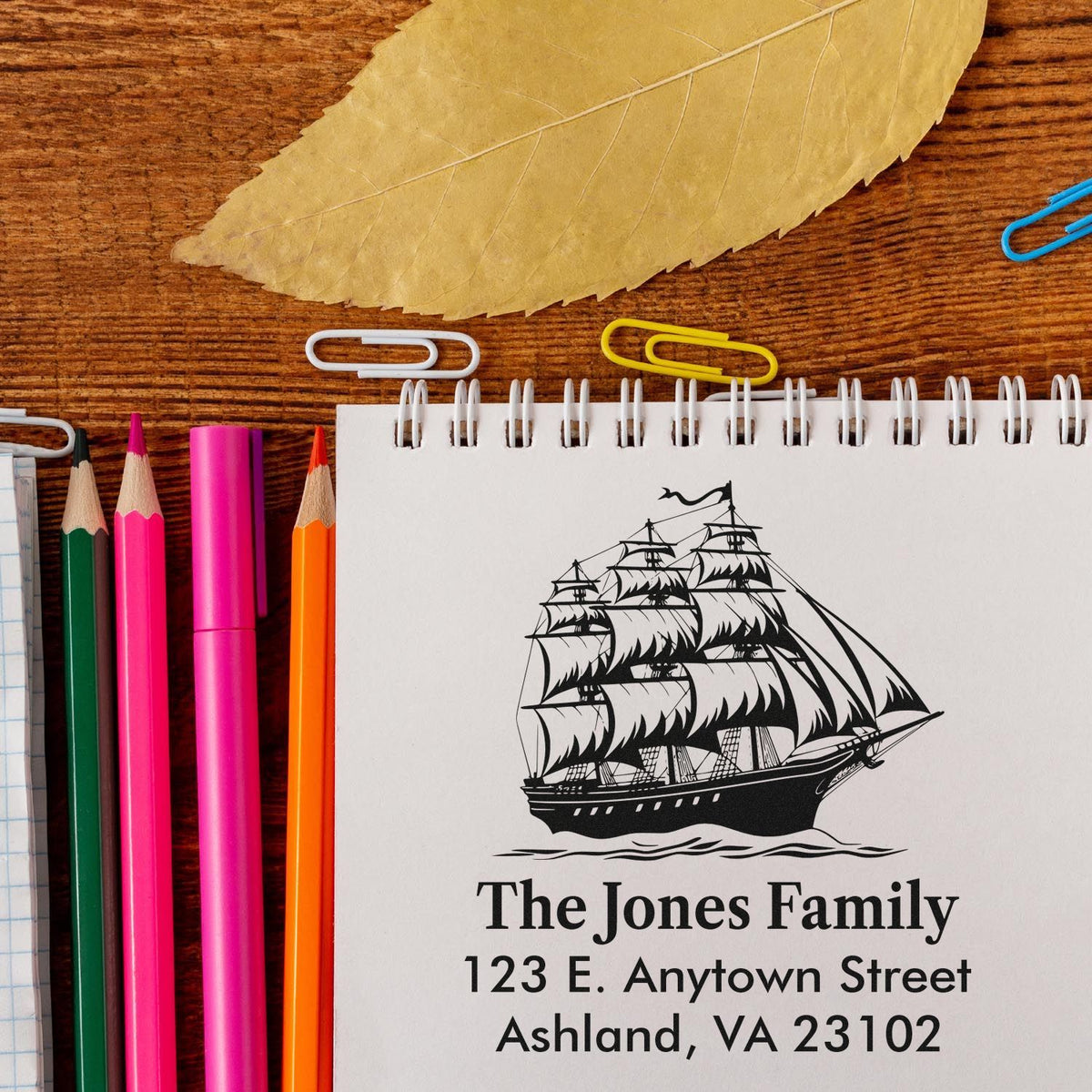 Custom nautical rubber stamp with tall ship design, family name, and return address for personalized stationery