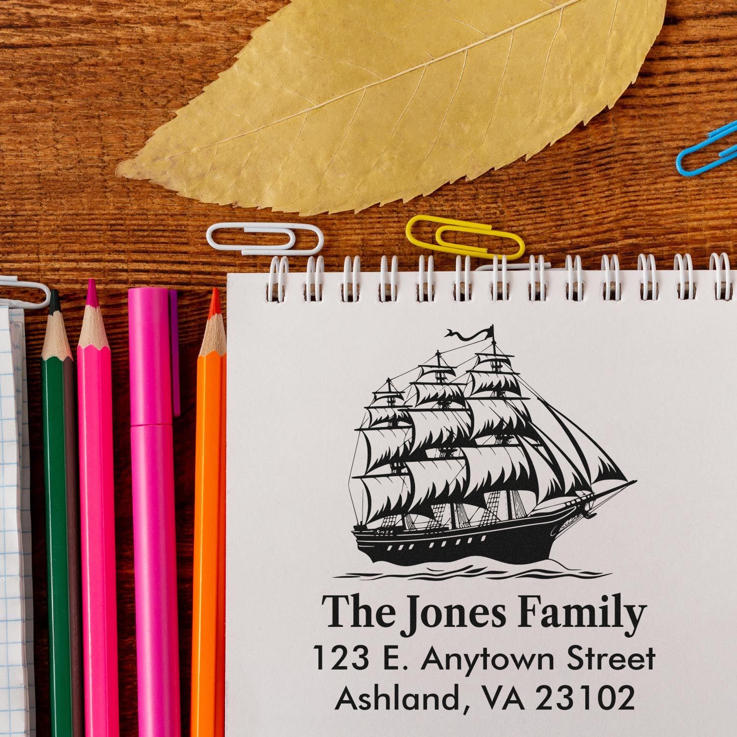Custom rubber return address stamp with sailing ship design for The Jones Family, 123 E. Anytown Street.