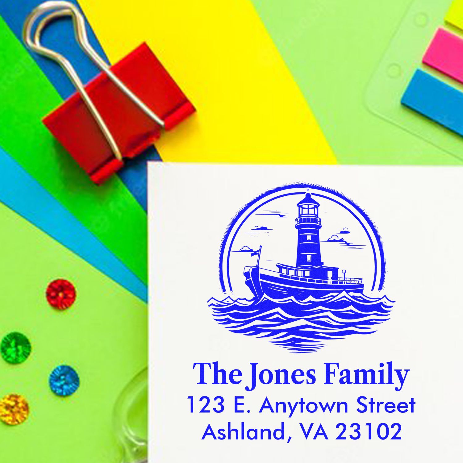 Custom return address rubber stamp with lighthouse logo, family name, and mailing address for personalized mailings.