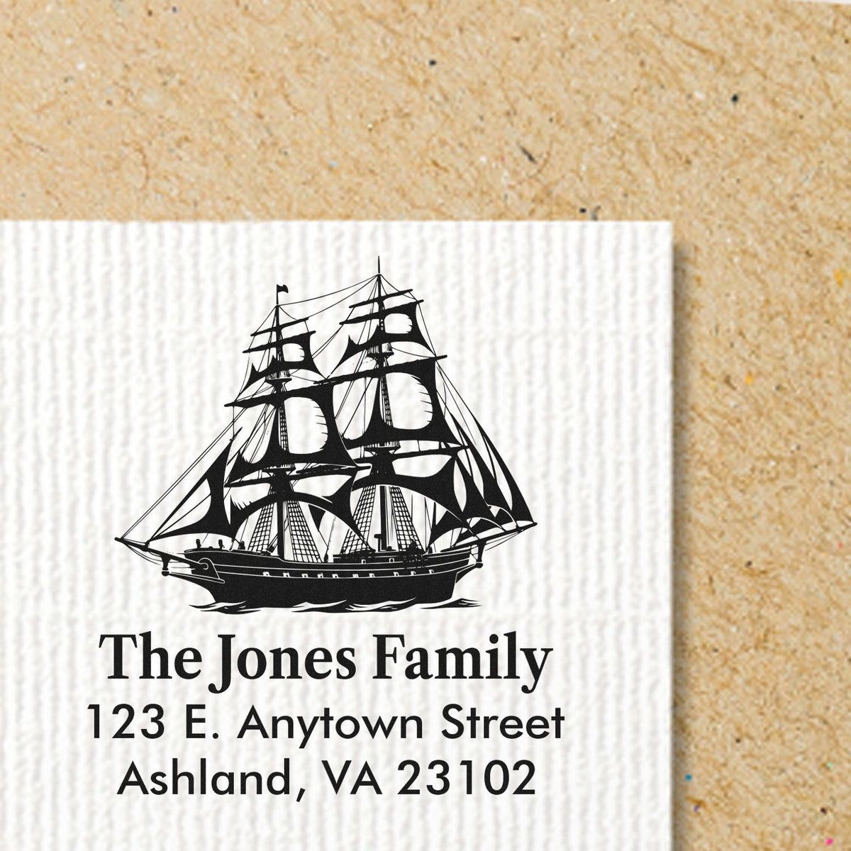 Personalized rubber stamp with sailing ship design and return address for The Jones Family, Ashland, VA 23102.