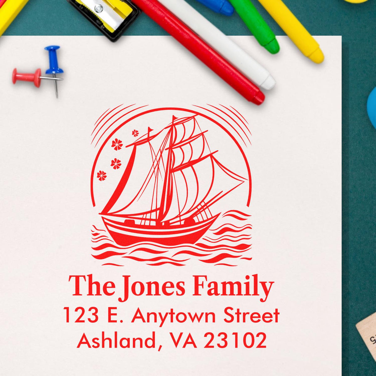 Custom personalized rubber stamp with sailboat design and return address for The Jones Family, Ashland, VA 23102.
