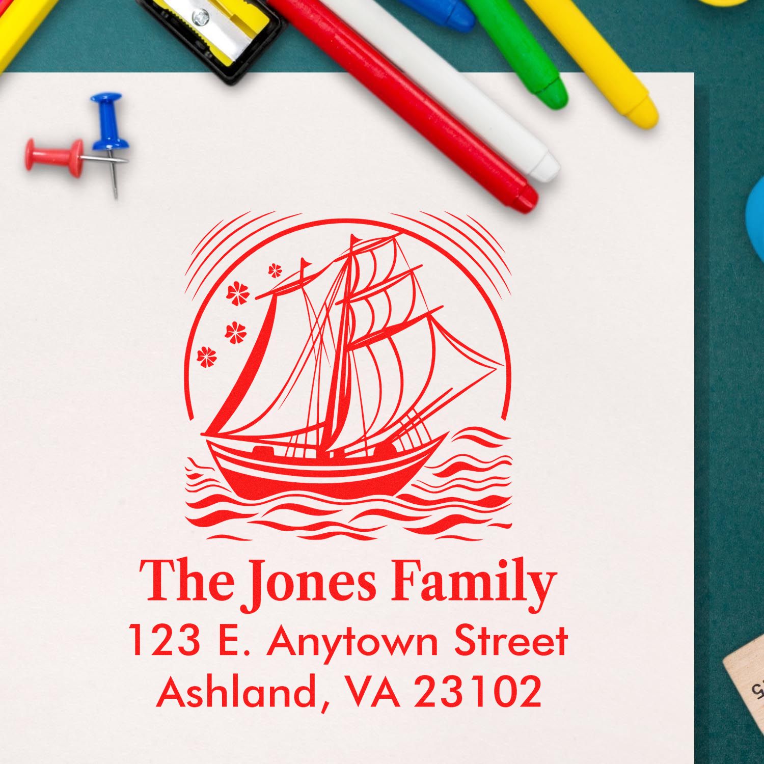 Custom rubber return address stamp with sailboat design for The Jones Family, 123 E. Anytown St., Ashland, VA 23102.