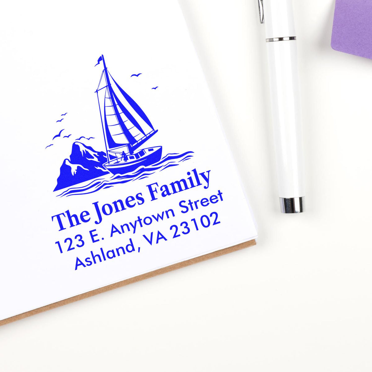 Custom nautical return address rubber stamp with sailboat design for The Jones Family, personalized home address stamp.