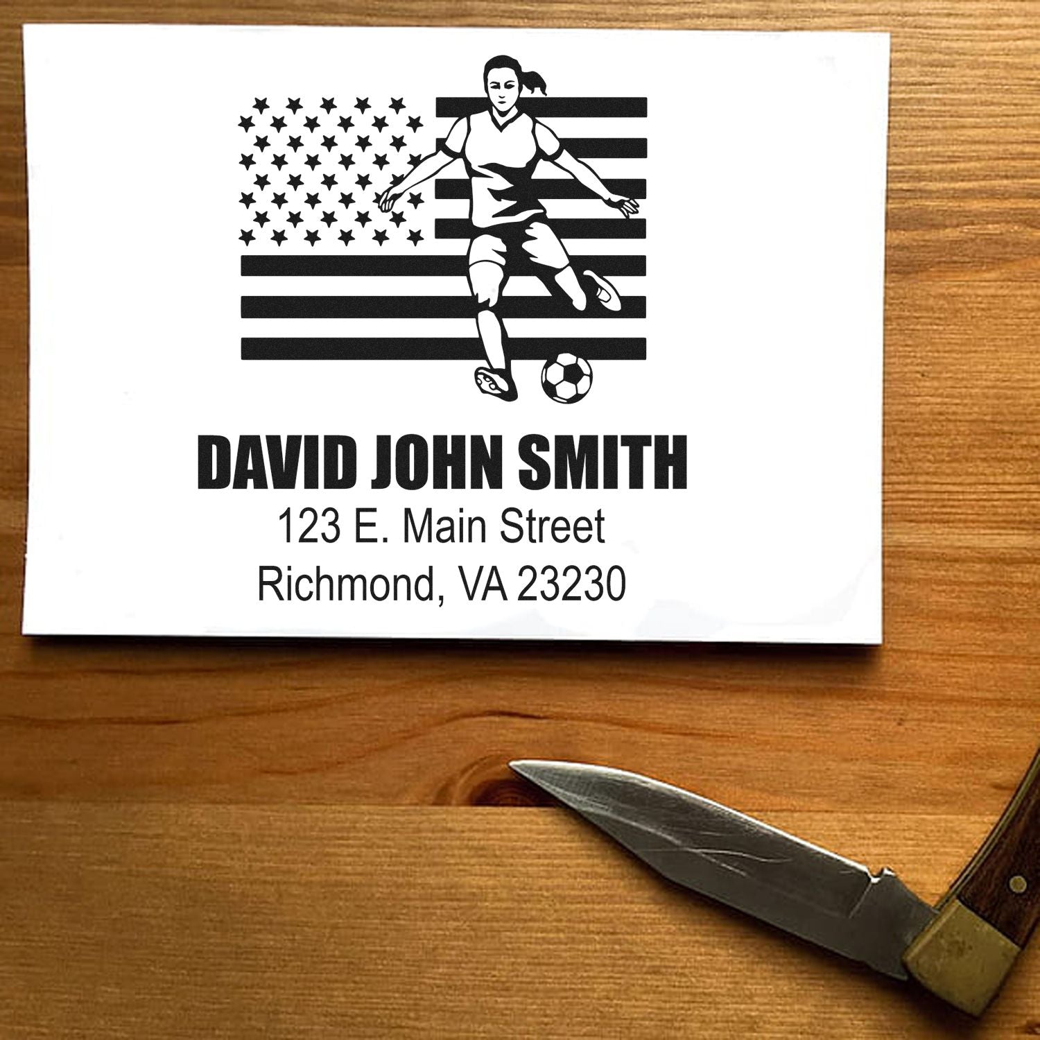 Custom address rubber stamp with soccer player and American flag design, plus name and mailing address for envelopes.