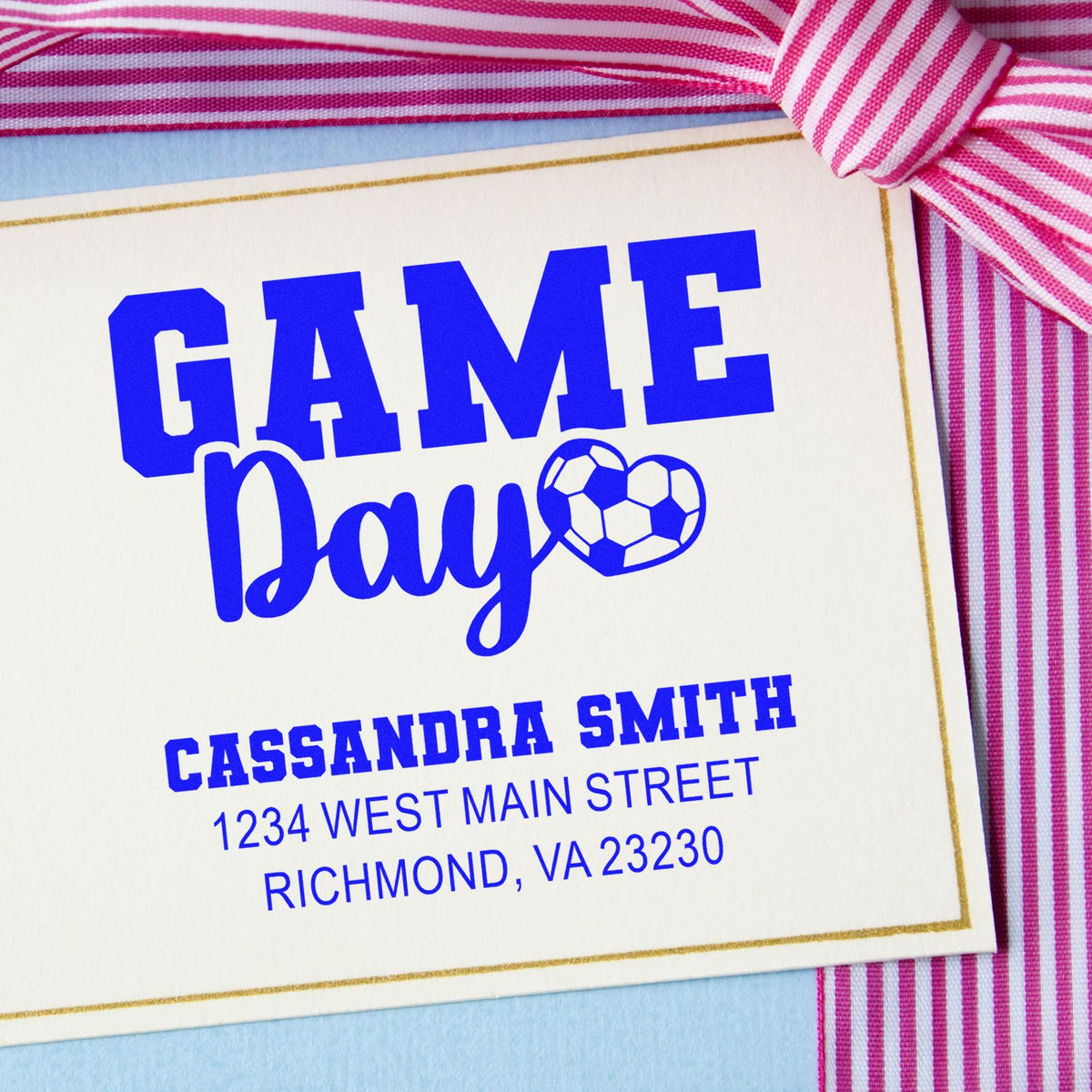 Custom Game Day rubber stamp design with soccer ball heart, name, and address for personalized soccer invitations.