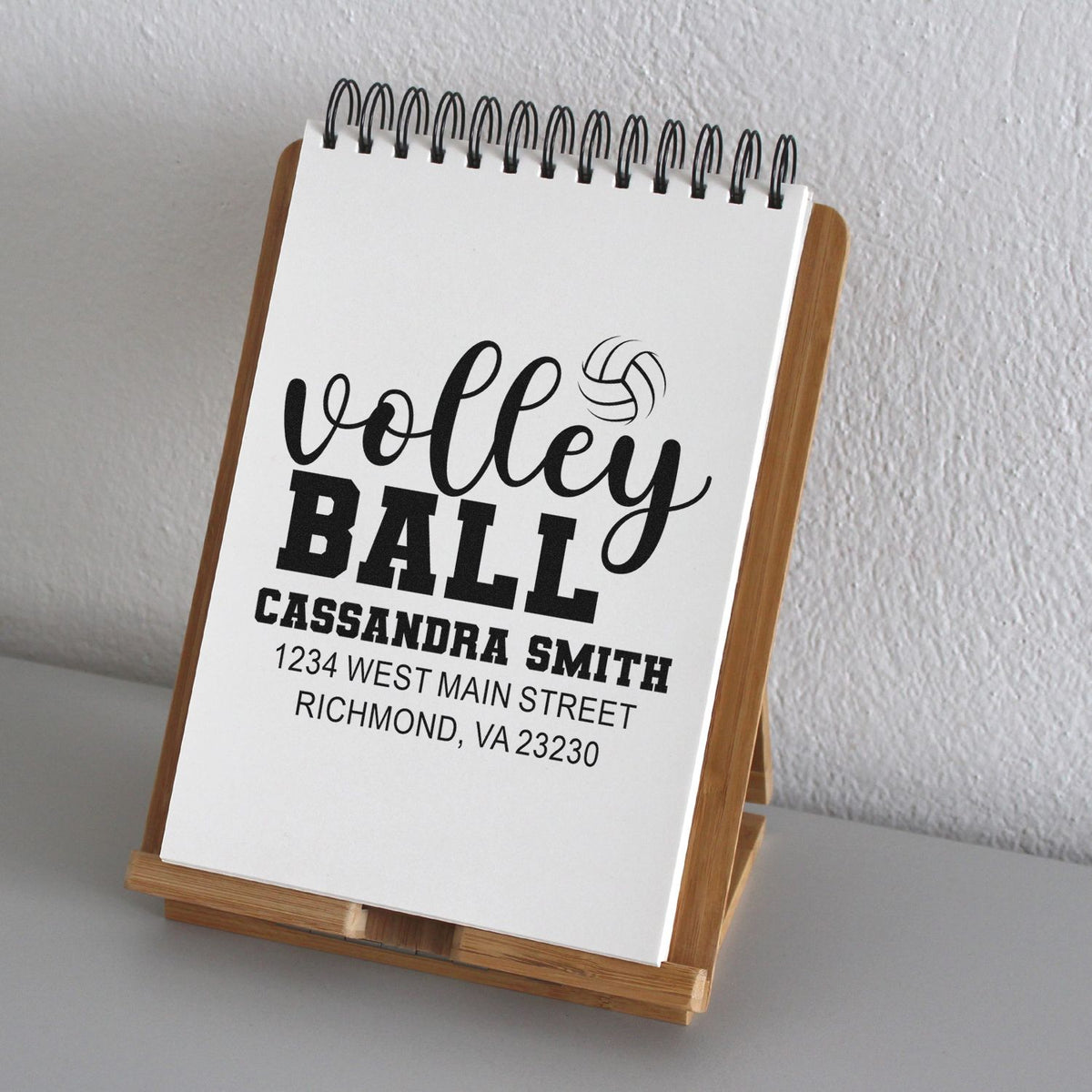 Custom volleyball rubber stamp design with personalized name and address for sports team stationery and mailings