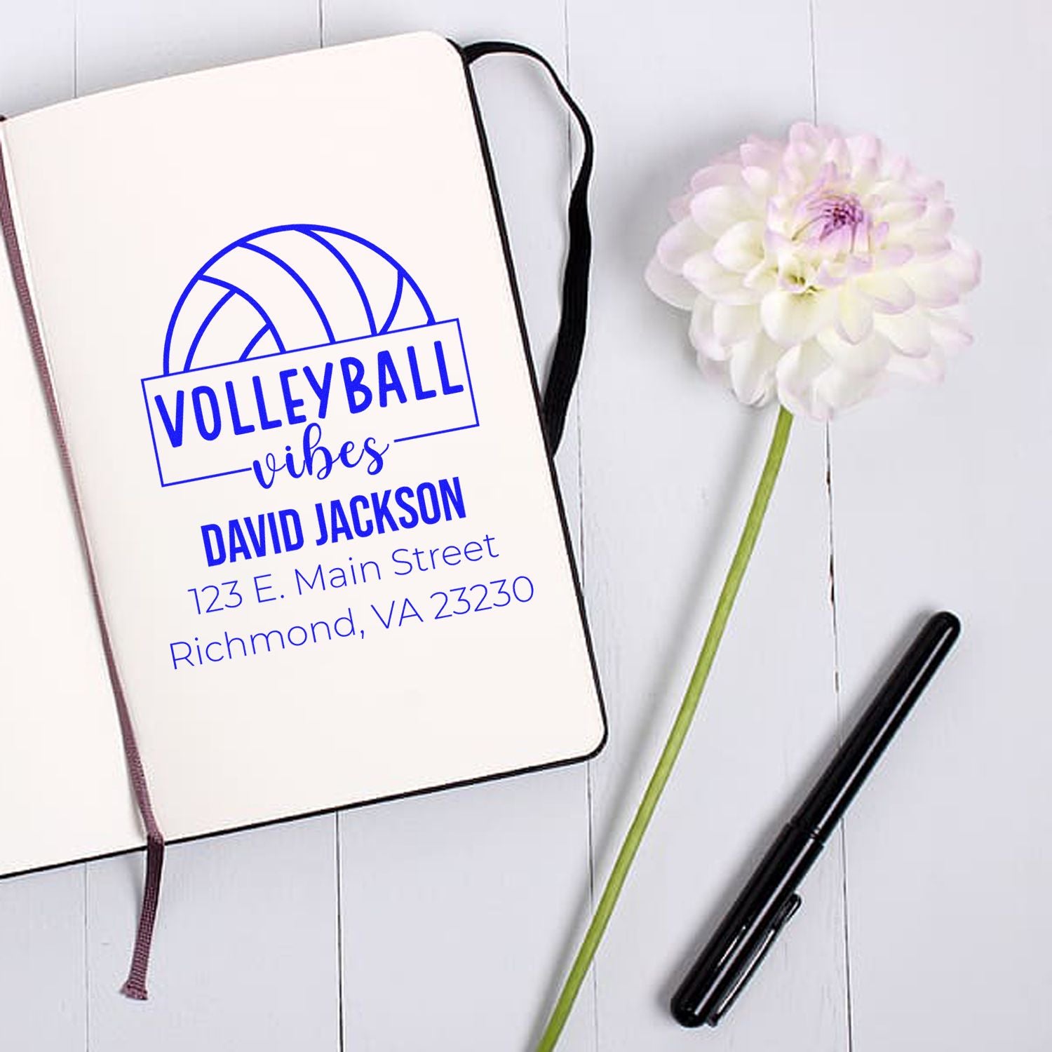 Personalized volleyball vibes rubber stamp mockup with name and address on notebook, ideal for custom sports return address stamping.