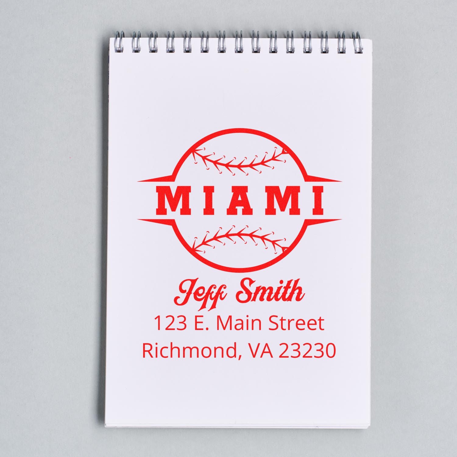 Custom Miami rubber stamp design with baseball logo, Jeff Smith name, and Richmond, VA address on a spiral notepad.