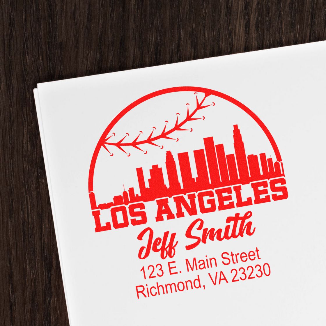 Custom return address rubber stamp with Los Angeles skyline, baseball seam, and personalized name and address.