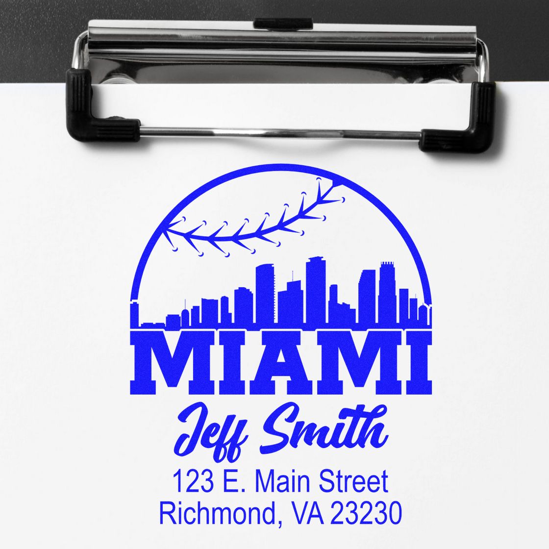 Custom rubber stamp impression with Miami skyline, airplane icon, and Jeff Smith address for business branding.