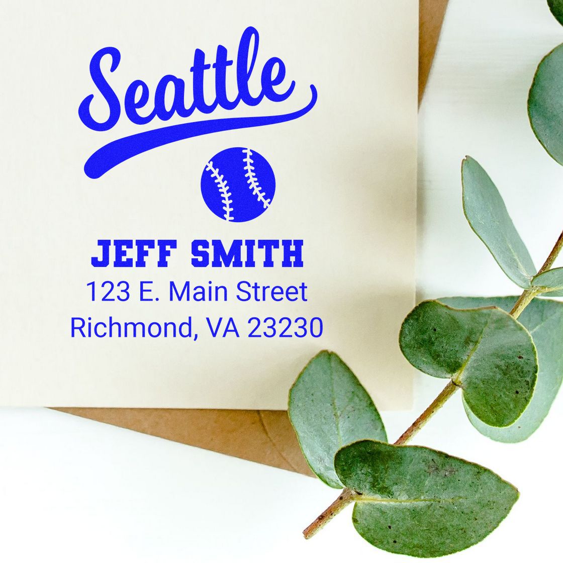 Custom Seattle baseball return address rubber stamp for Jeff Smith, shown on an envelope with address and greenery.