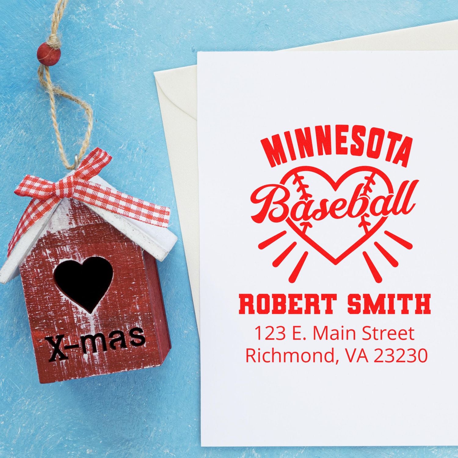 Custom Minnesota baseball rubber stamp with name and address, shown beside a rustic X-mas birdhouse ornament.