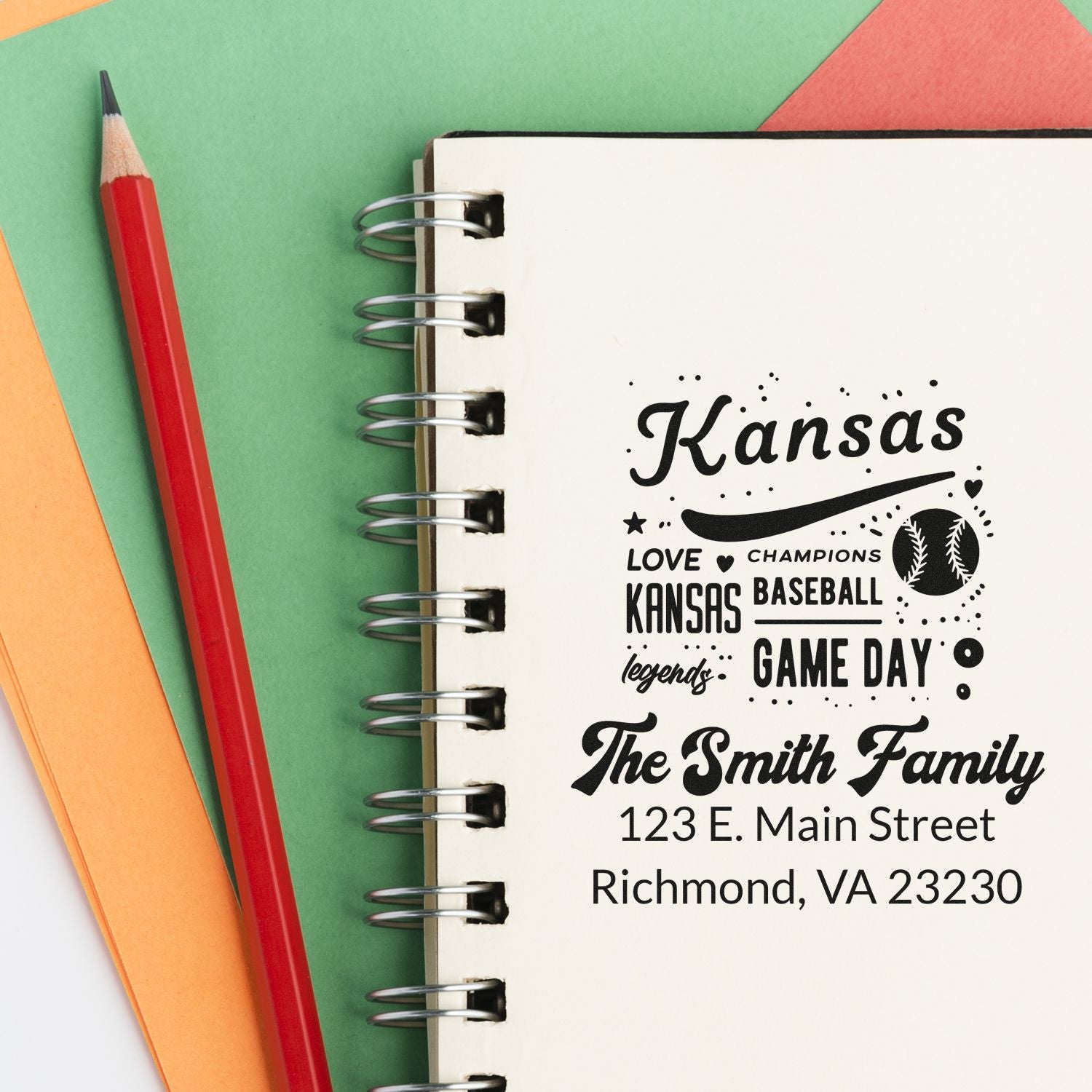 Personalized Kansas baseball family rubber stamp with name and address, printed on a notebook for custom stationery and game day gifts.